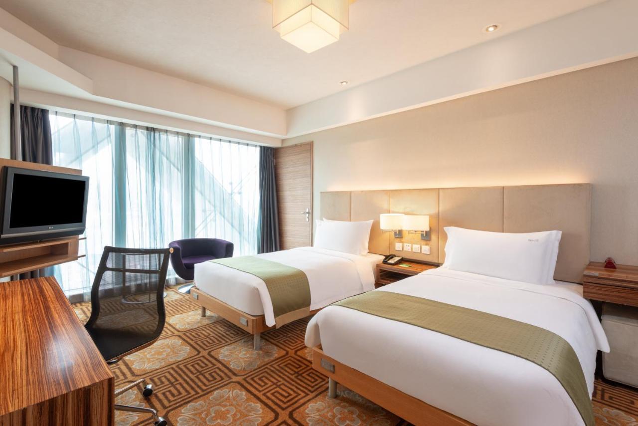 Holiday Inn Binhai Тяньцзінь Номер фото